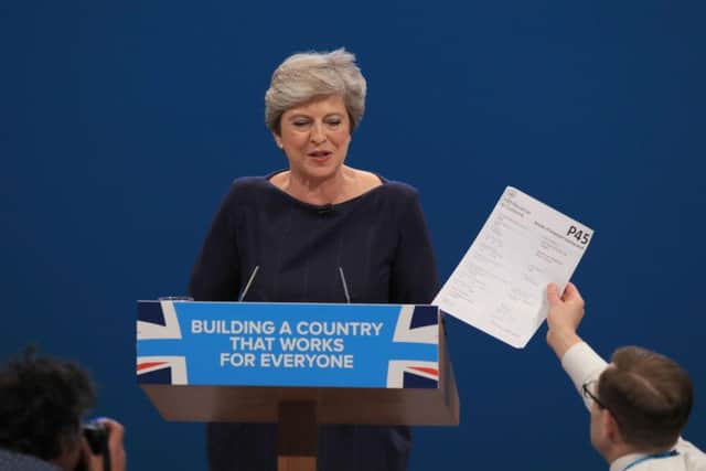 Comedian Simon Brodkin, also known as Lee Nelson. confronts Prime Minister Theresa May during her keynote speech. Picture: Peter Byrne/PA Wire