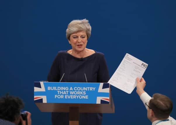 Comedian Simon Brodkin, also known as Lee Nelson. confronts Prime Minister Theresa May during her keynote speech. Picture: Peter Byrne/PA Wire
