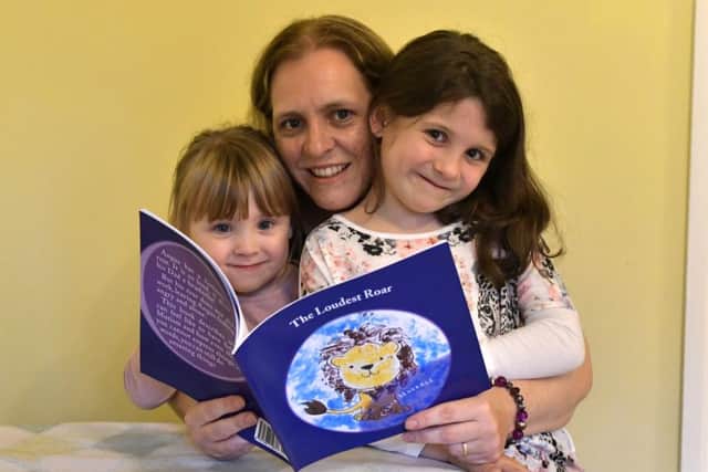 Author Clair Maskell with daughters Caitlyn and Emily  Picture: Neil Marshall (171166-2)