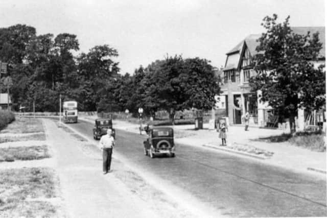Looking west along the A27 at Bedhampton. The bus is approaching the junction with Hulbert Road.