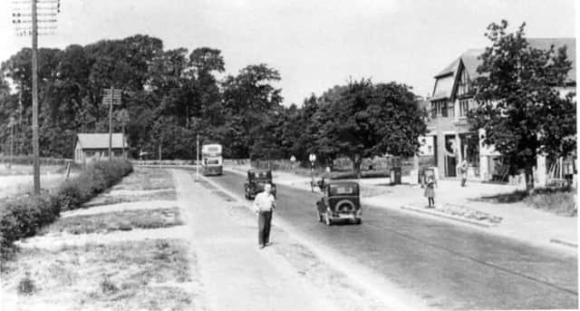 Looking west along the A27 at Bedhampton. The bus is approaching the junction with Hulbert Road.