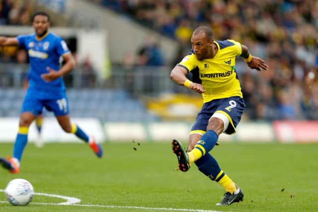 Wes Thomas scores against Wimbledon. Picture: PA