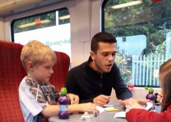 'Hero' Dan Ball plays with Gayna Pealling's children, Jack and Amy. Picture: Facebook/Gayna Pealling
