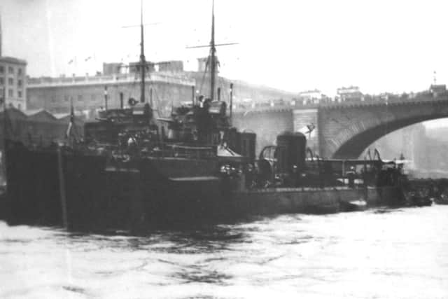 The River Class destroyer HMS Welland in the Pool of London. I am sure the bridge is the old London Bridge which was sold to America in 1967.