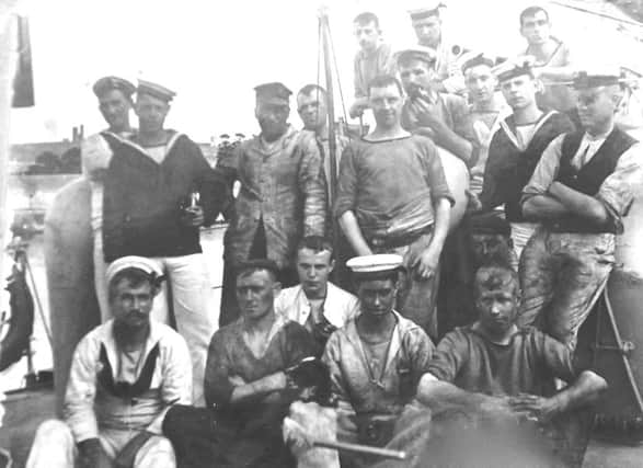 Sailors from HMS Chamois after coaling ship.