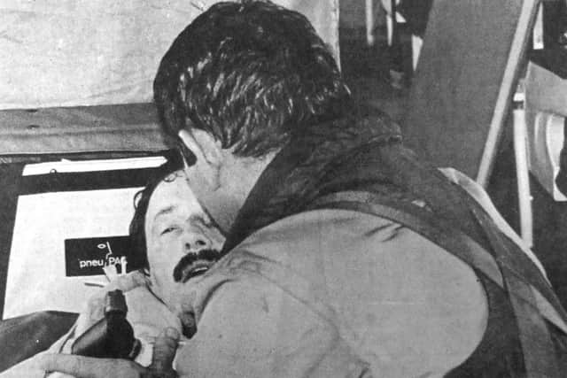 Tony Abbey, the man rescued from the storm-lashed yacht, being given treatment aboard the coastguard helicopter on its way to hospital