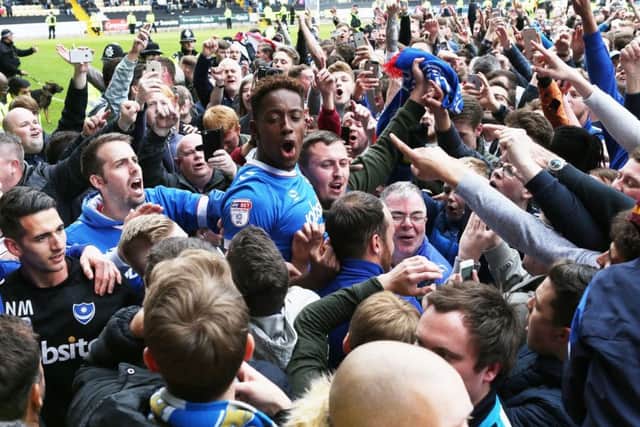 Jamal Lowe celebrates Pompey's promotion from League Two at Notts County. Picture: Joe Pepler