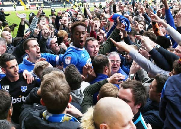 Jamal Lowe celebrates Pompey's promotion from League Two at Notts County. Picture: Joe Pepler