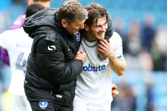 Matty Kennedy is congratulated for his winner at Gillingham by assistant manager Joe Gallen