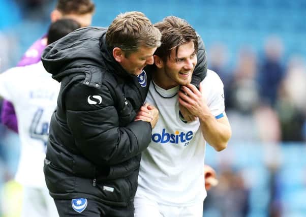 Matty Kennedy is congratulated for his winner at Gillingham by assistant manager Joe Gallen