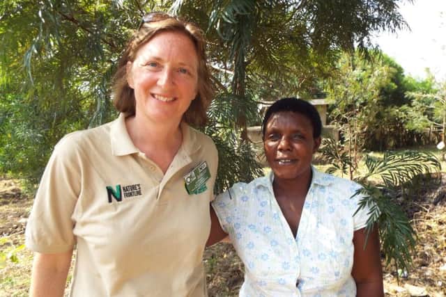 Liz Bourne with a wildlife officer on a previous trip to Uganda