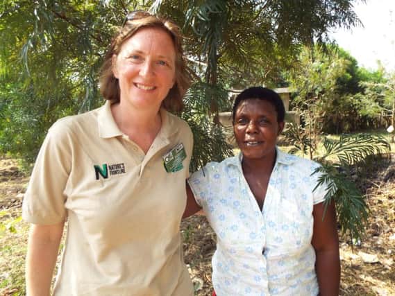 Liz Bourne with a wildlife officer on a previous trip to Uganda
