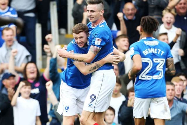 Dion Donohue congratulates Oli Hawkins following his opening goal in the win against MK Dons Picture: Joe Pepler