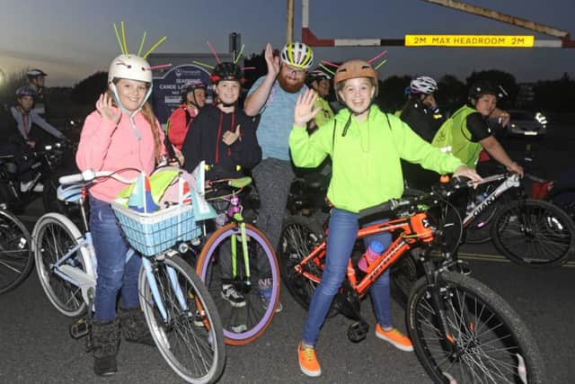 Cyclists equipped with glow sticks in their helmets take part in Southsea's Glow Ride (171233-06)