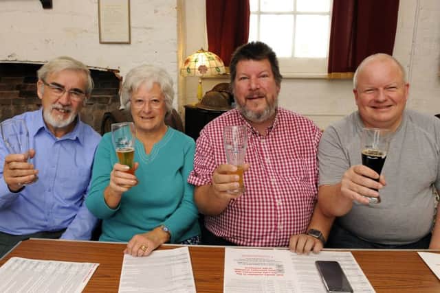 Peter Beech, Jennifer Beech, Philip Talbot and Ian Withall enjoy a drop of ale          Picture by Malcolm Wells (171013-5428)