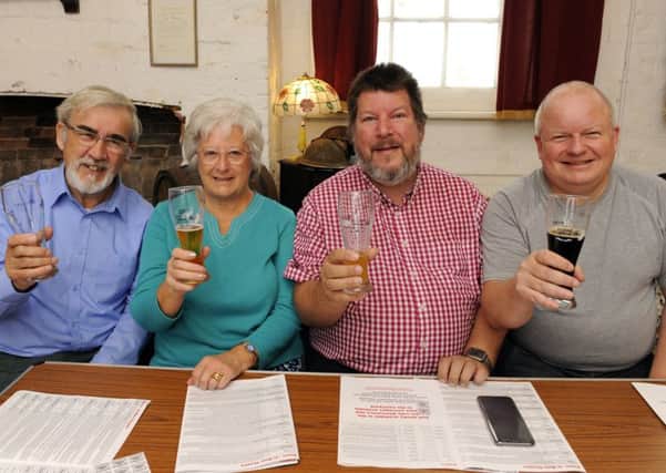 Peter Beech, Jennifer Beech, Philip Talbot and Ian Withall 
enjoy a drop of ale          Picture by Malcolm Wells (171013-5428)