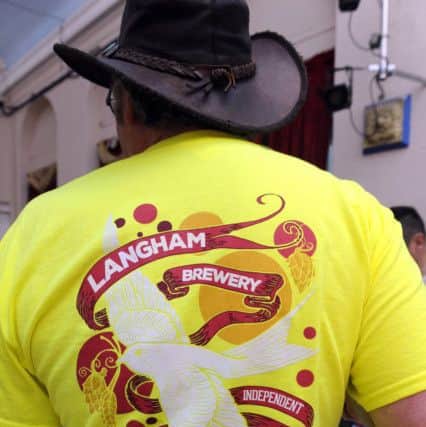 New colours, new design for The Langham Brewery logo  -  worn by Martyn Constable                 Picture by Malcolm Wells (171013-5432)