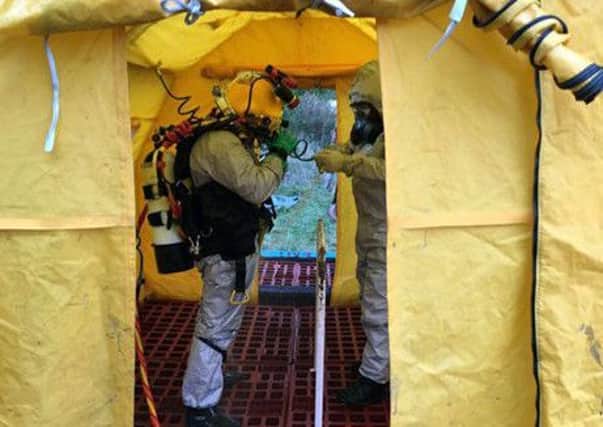 One of the Portsmouth divers going through decontamination. Picture: Royal Navy