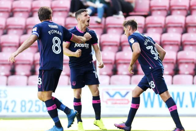 Conor Chaplin celebrates a goal against Wigan earlier this season. Picture: Joe Pepler