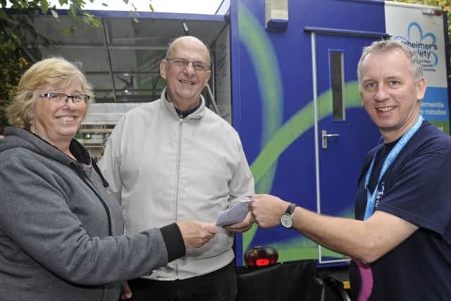 Rosie Trout from Drayton with her husband Daryl, who has dementia, talking to support worker Cliff Cropley. Picture: Ian Hargreaves (171236-1)