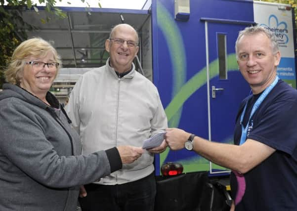 Rosie Trout from Drayton with her husband Daryl, who has dementia, talking to support worker Cliff Cropley.  Picture: Ian Hargreaves  (171236-1)