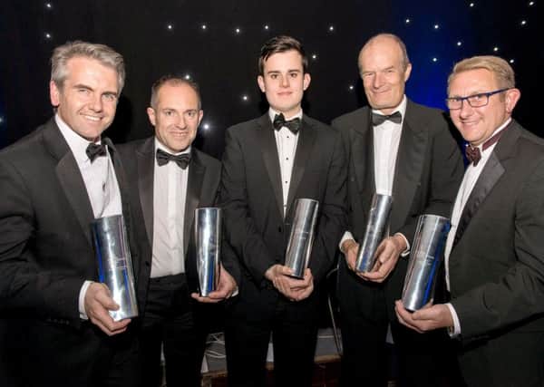 Winners proudly show off their property and construction awards. 
Picture: Huw Evans