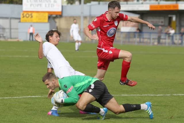 Alfie Rutherford's late strike rescued the Hawks as they drew 2-2 with Poole