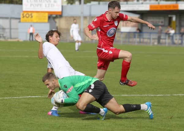 Alfie Rutherford's late strike rescued the Hawks as they drew 2-2 with Poole