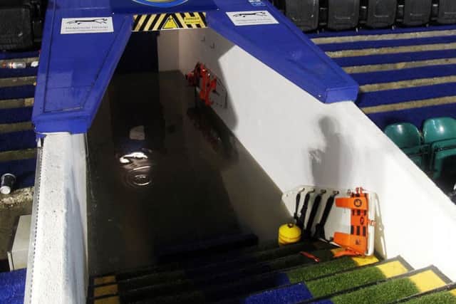 The tunnel at Fratton Park was filled with water after torrential rain forced the game against Wycombe in October 2013 to be abandoned