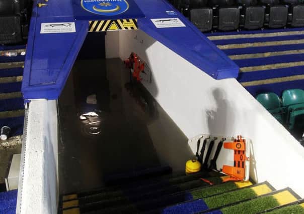 The tunnel at Fratton Park was filled with water after torrential rain forced the game against Wycombe in October 2013 to be abandoned