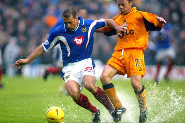 Pompey's Gianluca Festa is pressured by Leicester City's Paul Dickov in November 2002