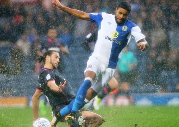 Christian Burgess goes in for a sliding tackle during Saturdays defeat at Blackburn Rovers Picture: Joe Pepler