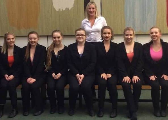 Gosport MP Caroline Dinenage, middle, with the all-female cast of How To Be A Girl! - a performance presented by students from Bay House School