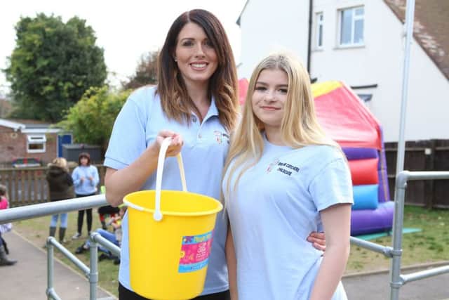 Dream Catchers' assistant manager Caroline Brennan with her daughter, Mia 14, raising money throughout the day   (171466-1)