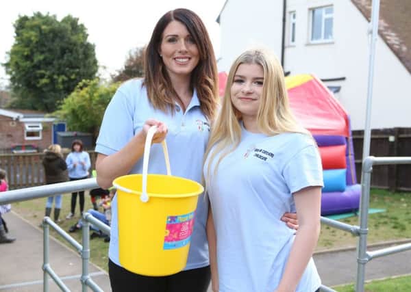 Dream Catchers' assistant manager 
Caroline Brennan with her daughter, Mia 14, raising money throughout the day   (171466-1)