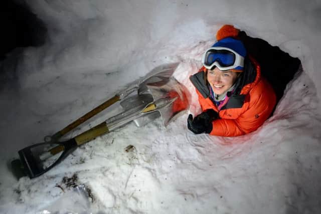 Nics Wetherill crawls into a snow shelter during training. Picture: Cpl Jamie Dudding RLC