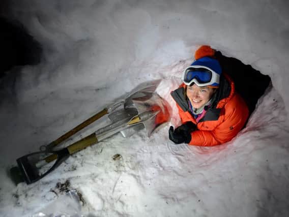 Nics Wetherill crawls into a snow shelter during training. Picture: Cpl Jamie Dudding RLC