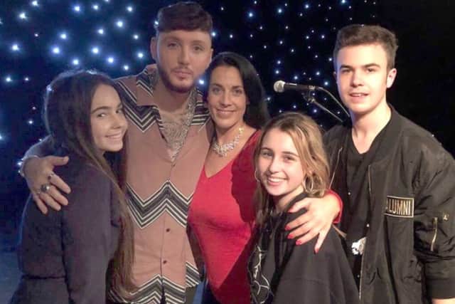Chloe Hine, left, with 2012 X Factor winner James Arthur and her mother, Emma, sister Jessica and brother Lewis