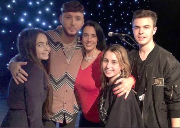 Chloe Hine, left, with 2012 X Factor winner James Arthur and her mother, Emma, sister Jessica and brother Lewis