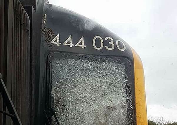 The smashed window on a Portsmouth Harbour to London train