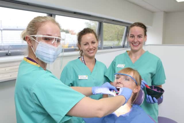 Students Verity Smith with Justina Dabkowska and Kimberley Loughran practicing on fellow student Chloe Squire Picture: Habibur Rahman