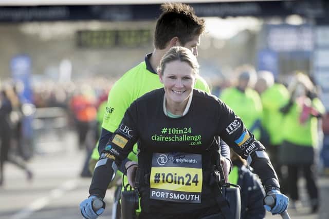 Claire Lomas approaches the finish line of the Great South Run after completing the 10-mile course in 24 hours using a robotic suit