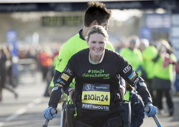 Claire Lomas approaches the finish line of the Great South Run after completing the 10-mile course in 24 hours using a robotic suit