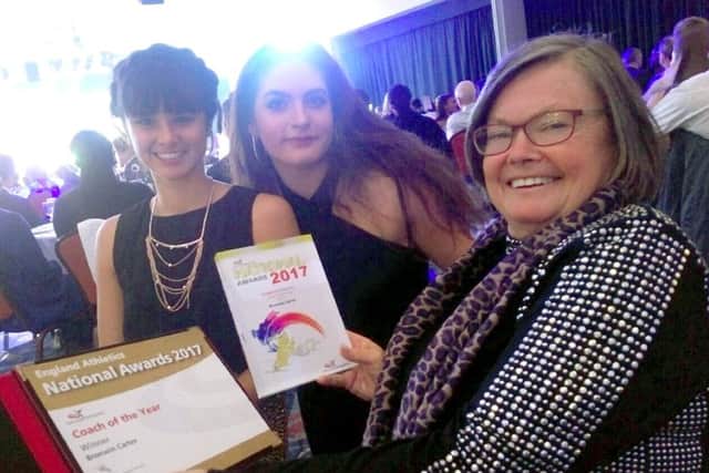 Bronwin Carter, right, with two of her athletes, Serena Vincent, left, and Gaia Osborne, at the awards night