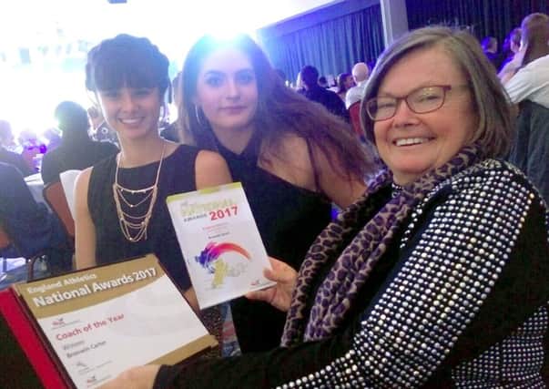 Bronwin Carter, right, with two of her athletes, Serena Vincent, left, and Gaia Osborne, at the awards night