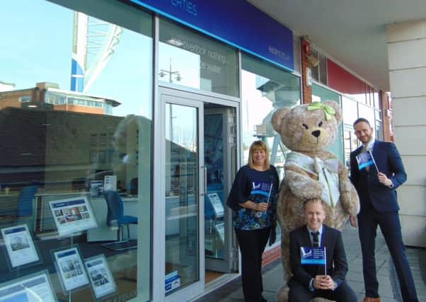 Betty the bear with the Portsmouth Leaders team, Vanessa Dixon, Edward Howells and Phil Bega