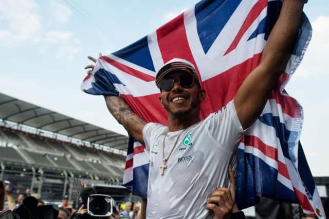 Mercedes' Lewis Hamilton celebrates winning the Formula One drivers' championship during the Mexican Grand Prix at the Autodromo Hermanos Rodriguez, Mexico City. 
Picture: PA Wire.