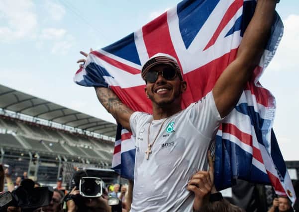 Mercedes' Lewis Hamilton celebrates winning the Formula One drivers' championship during the Mexican Grand Prix at the Autodromo Hermanos Rodriguez, Mexico City. 
Picture: PA Wire.
