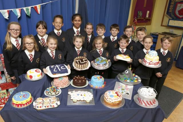 Pupils at Hordean C of E Junior School, Waterlooville with their spectcular creations made for a school Bake Off contest to raise money for Children in Need
Picture: Habibur Rahman
