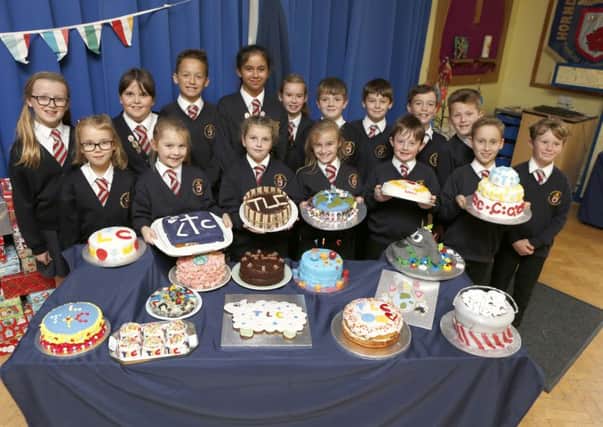 Pupils at Hordean C of E Junior School, Waterlooville with their spectcular creations made for a school Bake Off contest to raise money for Children in Need     
Picture: Habibur Rahman